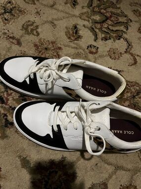 Cole Haan women’s , Black & Gold Leather Sneakers